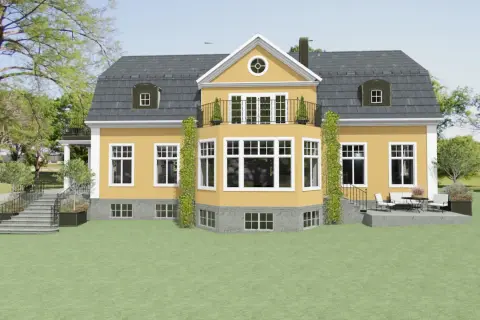 Ett charmigt gult hus med ett mörkt, svart tak. En balkong med smidesräcke och klätterväxter ramar in husets mitt.
