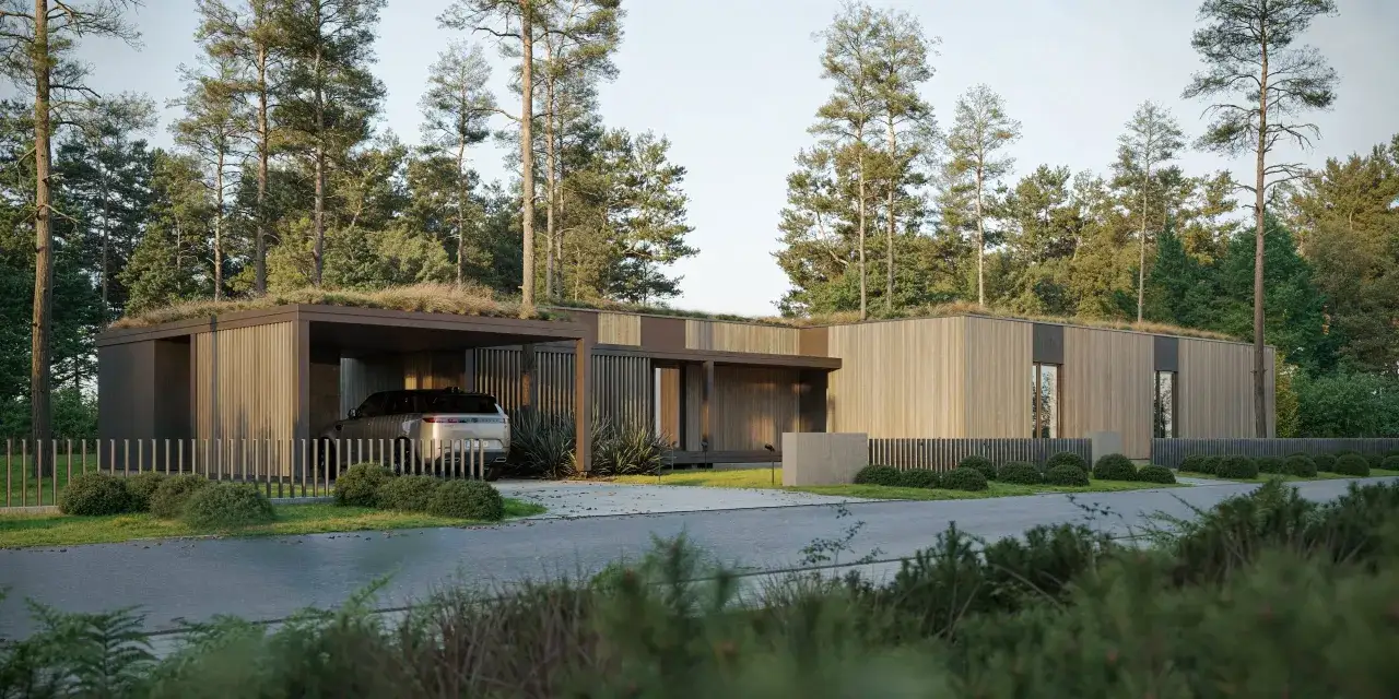 Moderna, färdiga hus med gröna tak, klädda i trä, omgivna av skog. En bil står parkerad under ett tak.